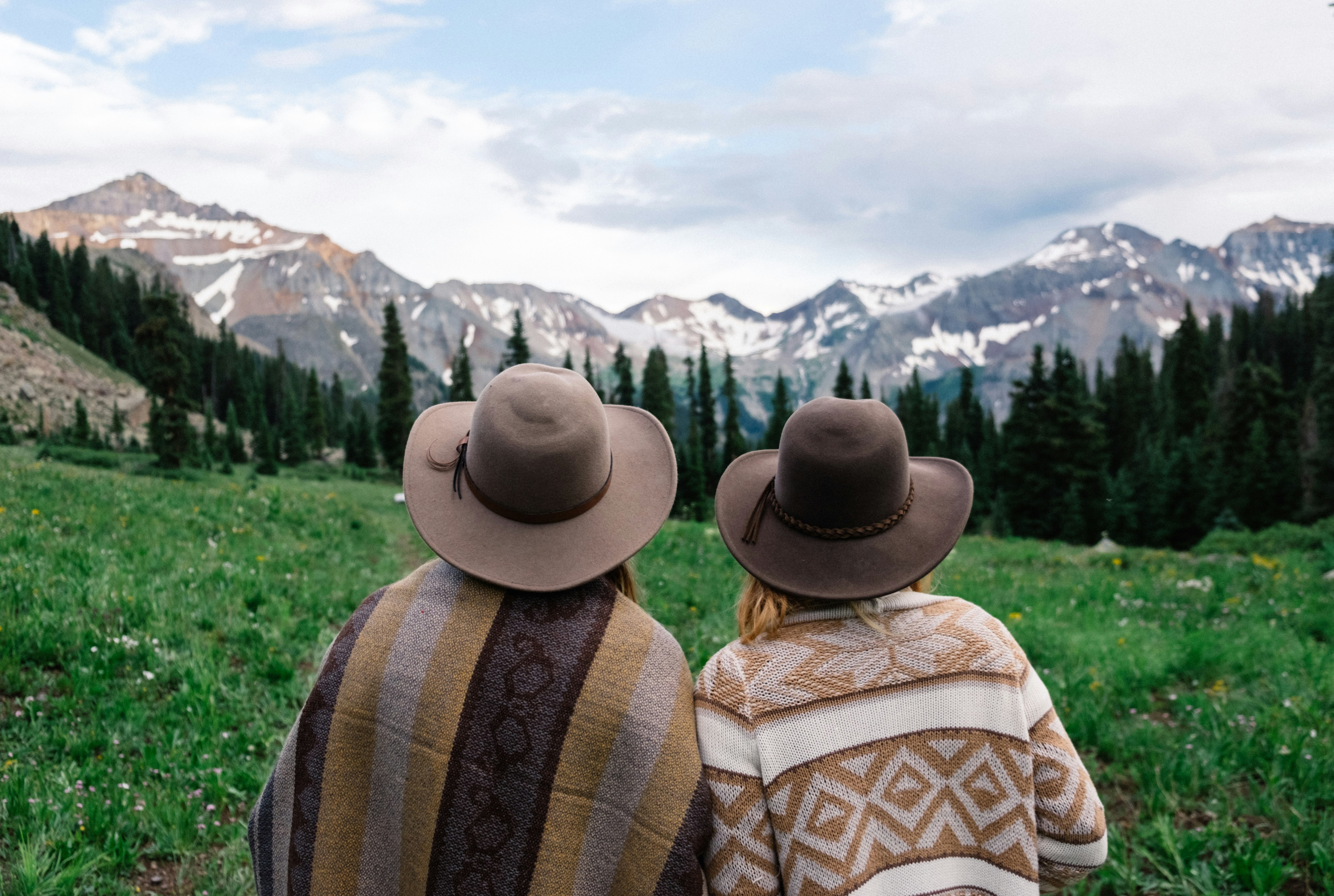 two people looking at the mountains